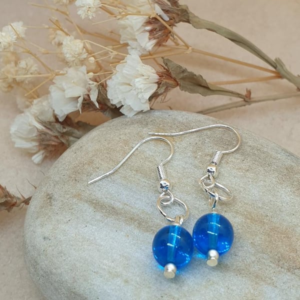Lovely silver  plated earrings with beautiful blue azure blue glass beads 