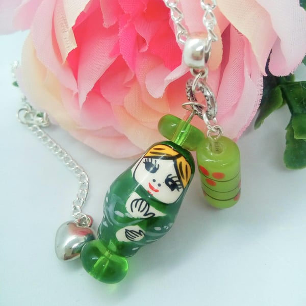 Green Russian Doll and Lampwork Bead  Pendant on a Silver Plated Chain