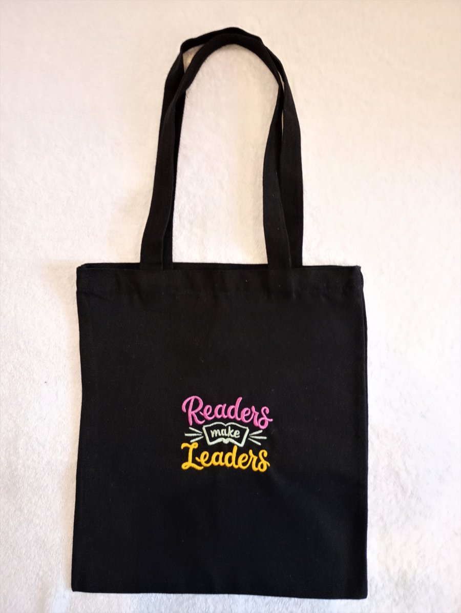 Tote Bag Machine Embroidered with the phrase Readers make Leaders