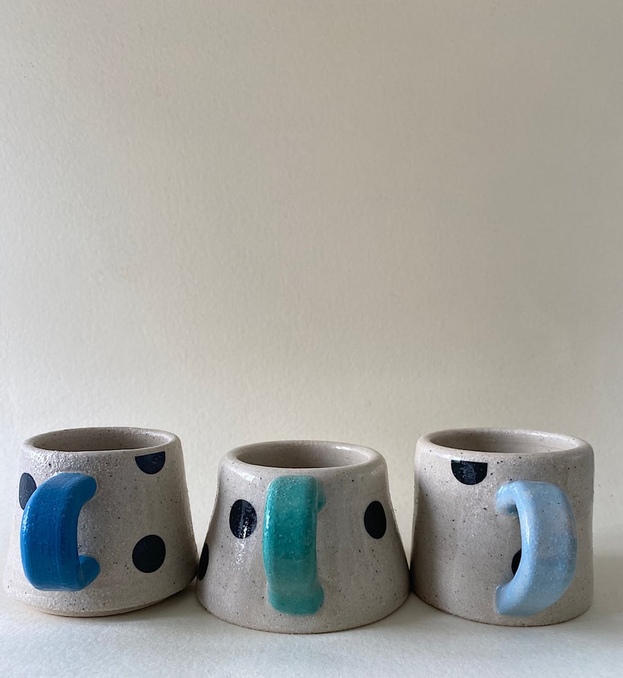 Set of 3 spotty handmade ceramic cups.