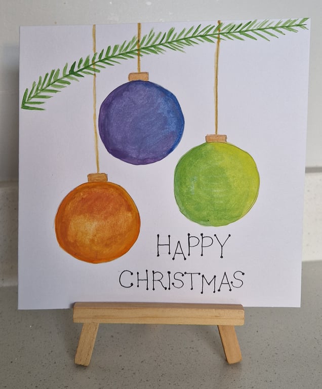Three hanging colourful Christmas baubles Christmas card handpainted watercolour