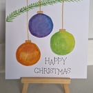 Three hanging colourful Christmas baubles Christmas card handpainted watercolour
