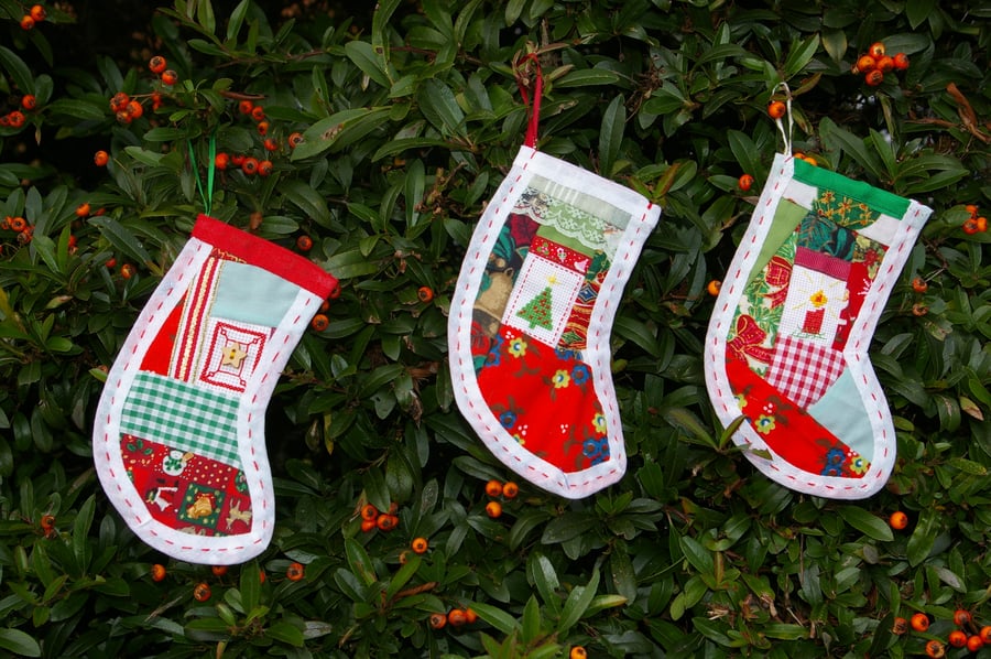 Trio of Christmas stocking decorations in patchwork and cross stitch