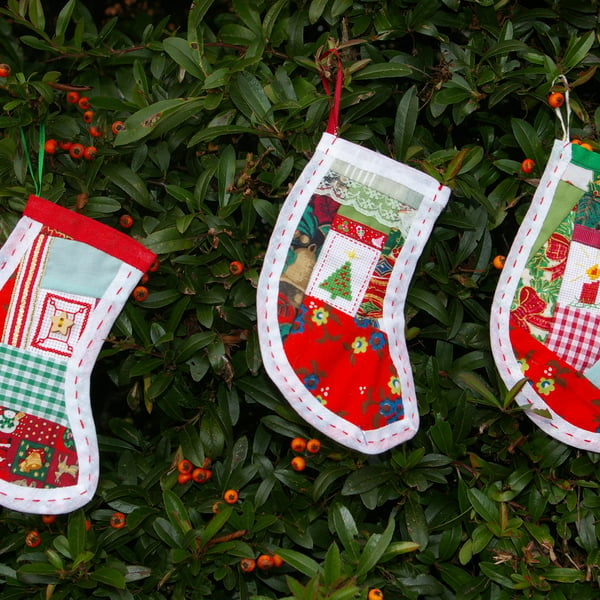 Trio of Christmas stocking decorations in patchwork and cross stitch