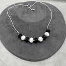 black and white lampwork glass necklace seaglass style
