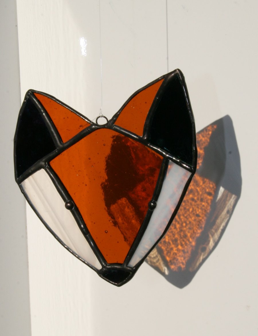 Stained glass fox head suncatcher. Traditional Tiffany style.