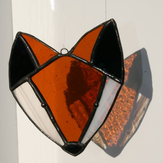 Stained glass fox head suncatcher. Traditional Tiffany style.