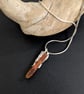 Raw Orange Kyanite Sterling Silver Pendant on a Silver Necklace