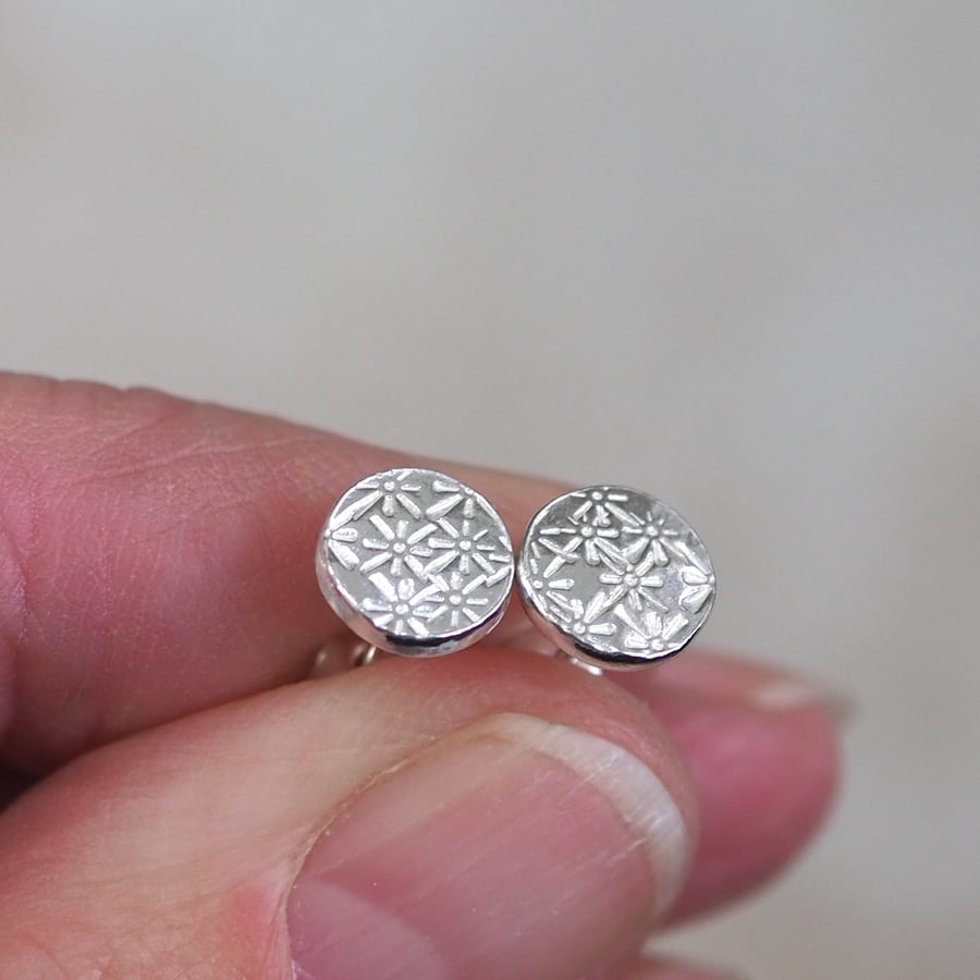 Floral starburst silver disc stud earrings, flower studs