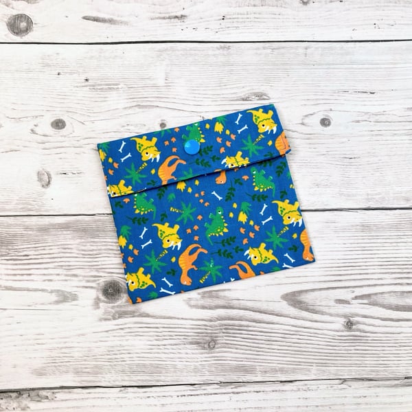 Dinosaurs themed discreet sanitary polycotton blue fabric pouch.