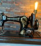 Vintage (1920s) up cycled Jones Family CS sewing machine into a table lamp