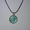 Handmade green pendant on black waxed cord