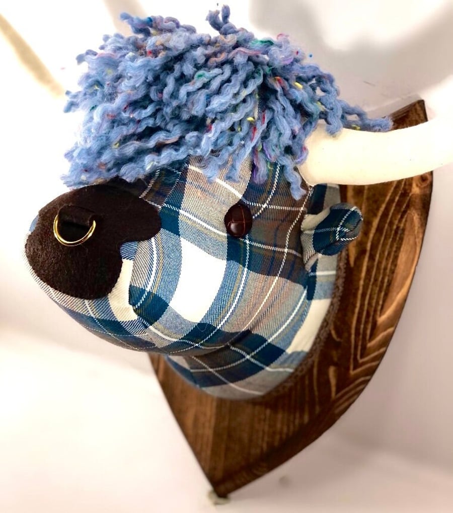 Bespoke Highland cow trophy head, made in tartan and tweeds.