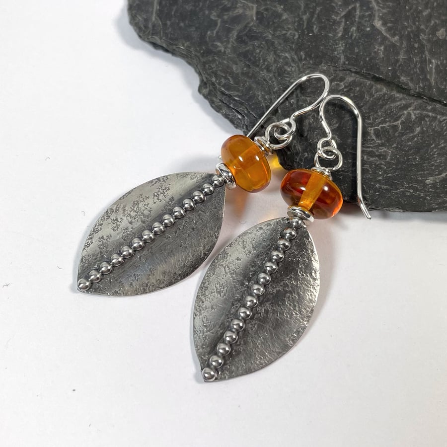 Silver shield earrings with amber beads