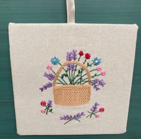 Basket of flowers hand embroidered picture.