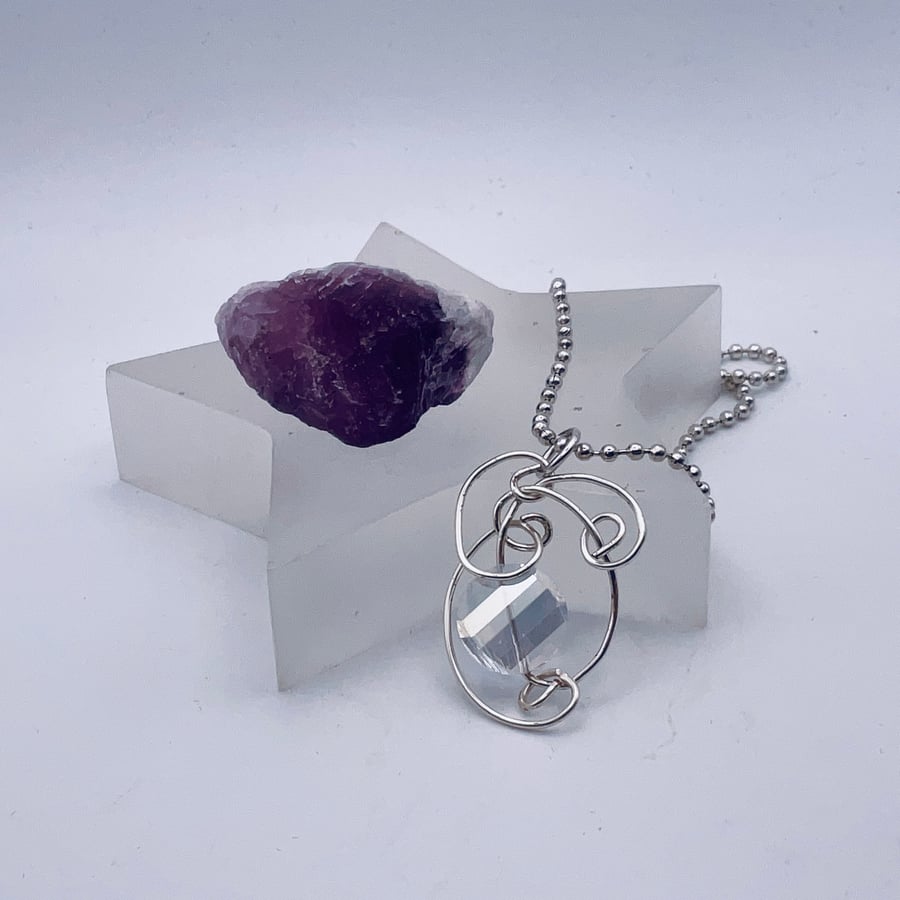 Stunning Swarovski clear crystal disc cut glass and silver wire wrapped pendant