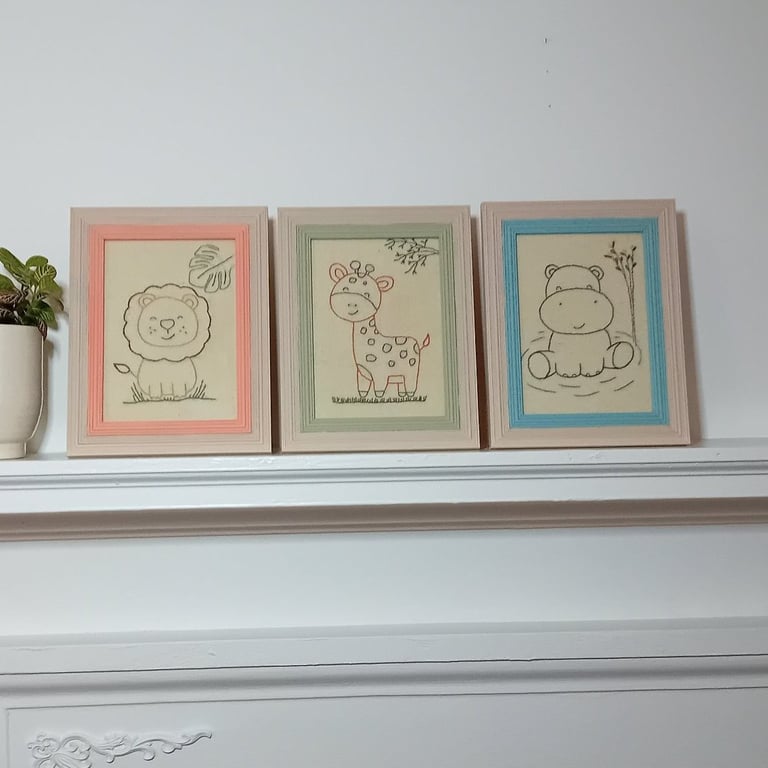 Set of three hand embroidered framed pictures