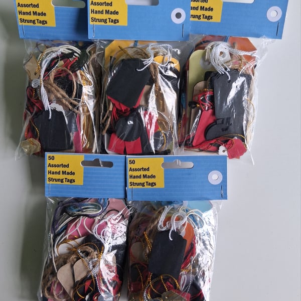 50 assorted tags with strings Various sizes & colours