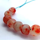 10 African round beads of recycled glass 13 - 15 mm, clear mottled with red