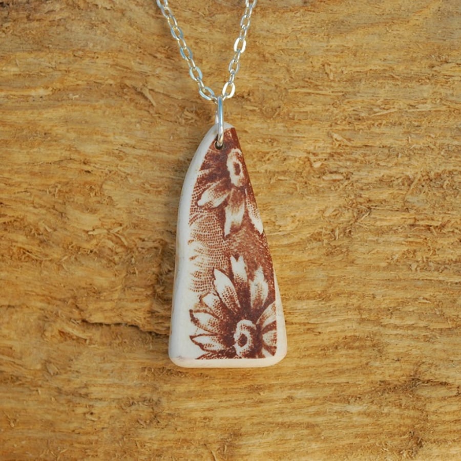 Beach pottery pendant with brown flowers