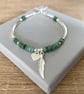 Green Emerald Gemstone Noodle Bracelet, Sterling Silver Feather Charm Bracelet - Image 1