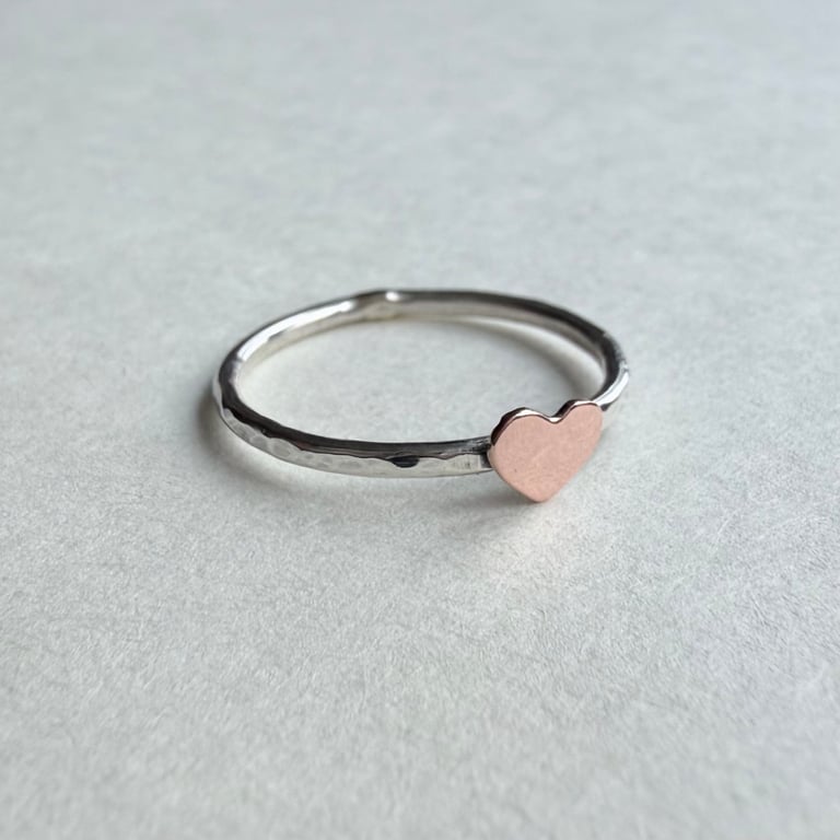 Hammered silver ring with copper heart