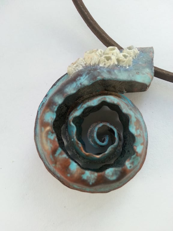 Copper spiral pendant with barnacles 