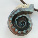 Copper spiral pendant with barnacles 
