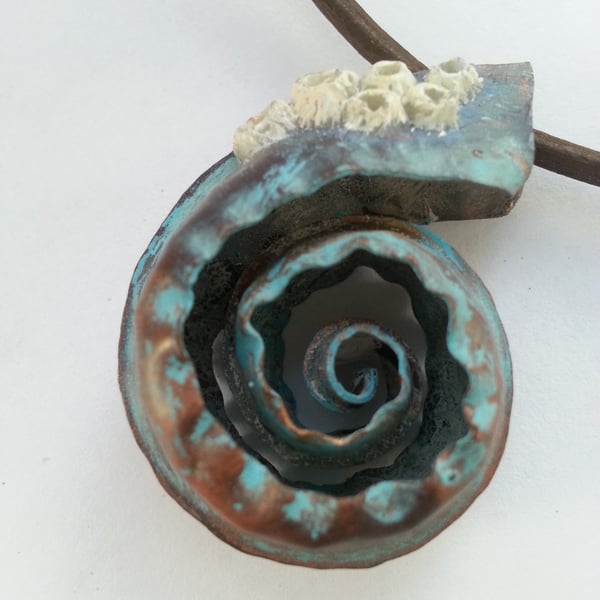 Copper spiral pendant with barnacles 