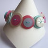 Turquoise, pink and pearlescent button bracelet 
