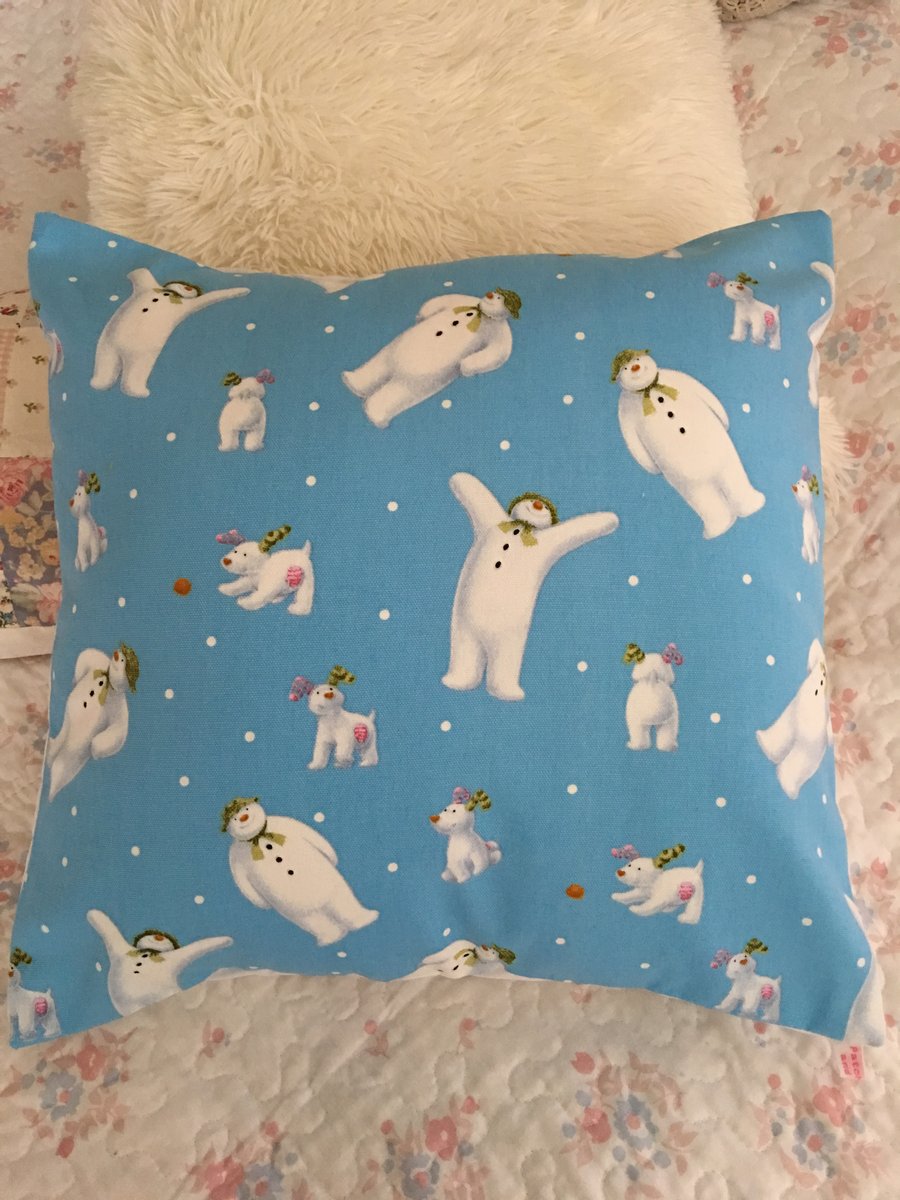 The snowman and the snow dog design fabric cushion cover