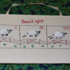 Counting sheep hand embroidered picture.