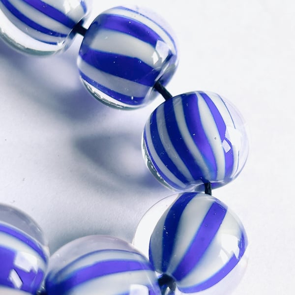 Handmade blue and white striped lamp work glass beads