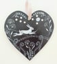 Hare leaping in starlight on wood