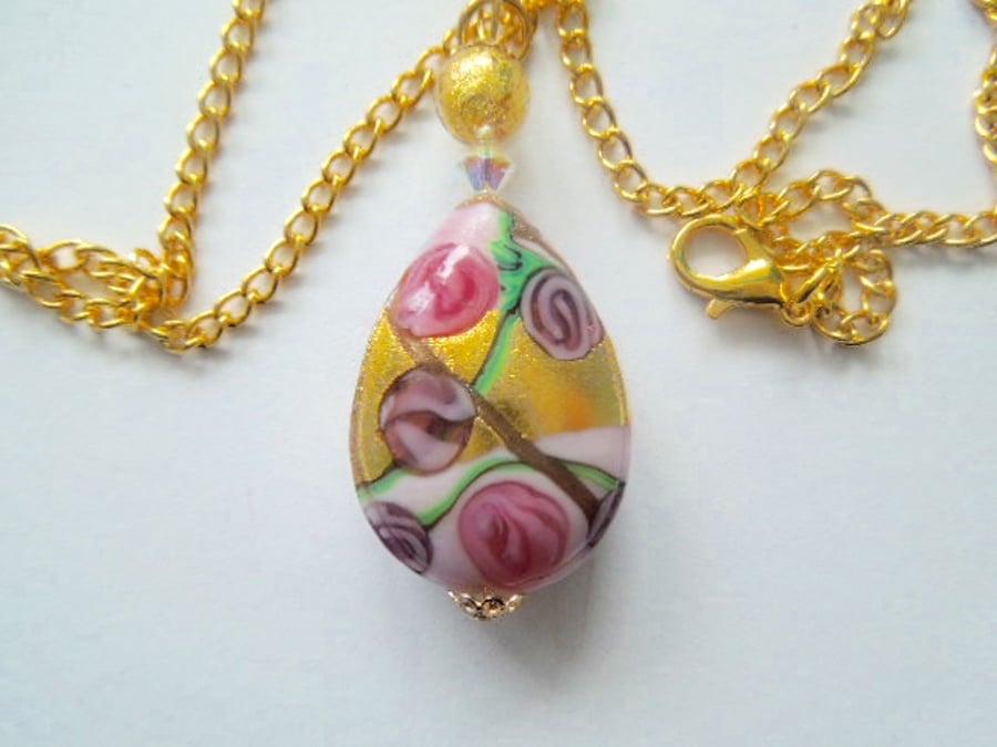 Murano glass gold and pink pear drop pendant with Swarovski crystal.