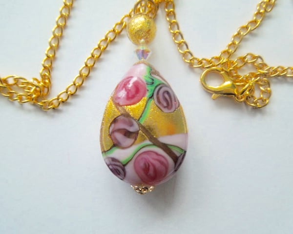 Murano glass gold and pink pear drop pendant with Swarovski crystal.