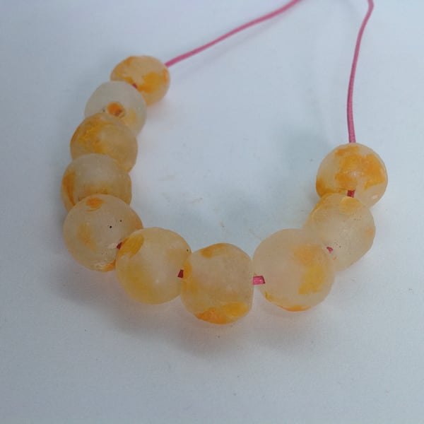 10 African round beads of recycled glass 13 - 15 mm, clear mottled with orange 
