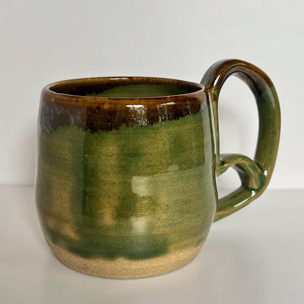 Green and iron pottery mug with ornate handle no.1