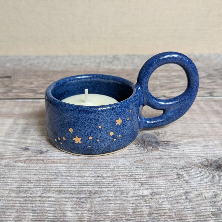 Blue ceramic tealight holder with gold stars