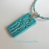 SALE  - Ceramic pendant necklace impressed with a floral design