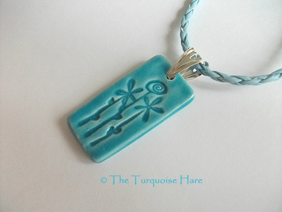 SALE  - Ceramic pendant necklace impressed with a floral design