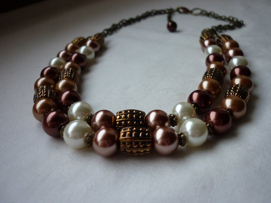CINNAMON, BRONZE, OLD GOLD AND IVORY TWO STRAND NECKLACE.  752