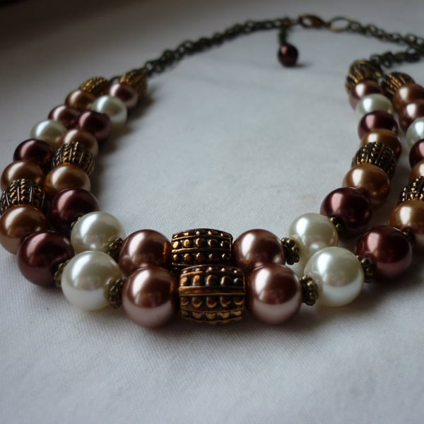 CINNAMON, BRONZE, OLD GOLD AND IVORY TWO STRAND NECKLACE.  752