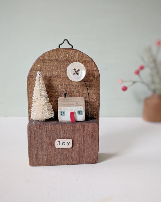 Festive Wooden Cottage Scene with Tree and Moon 'joy'
