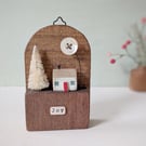Festive Wooden Cottage Scene with Tree and Moon 'joy'