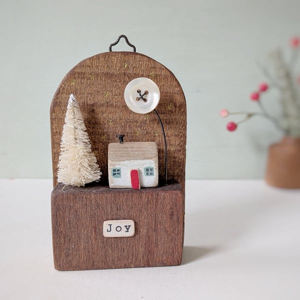 Festive Wooden Cottage Scene with Tree and Moon 'joy'