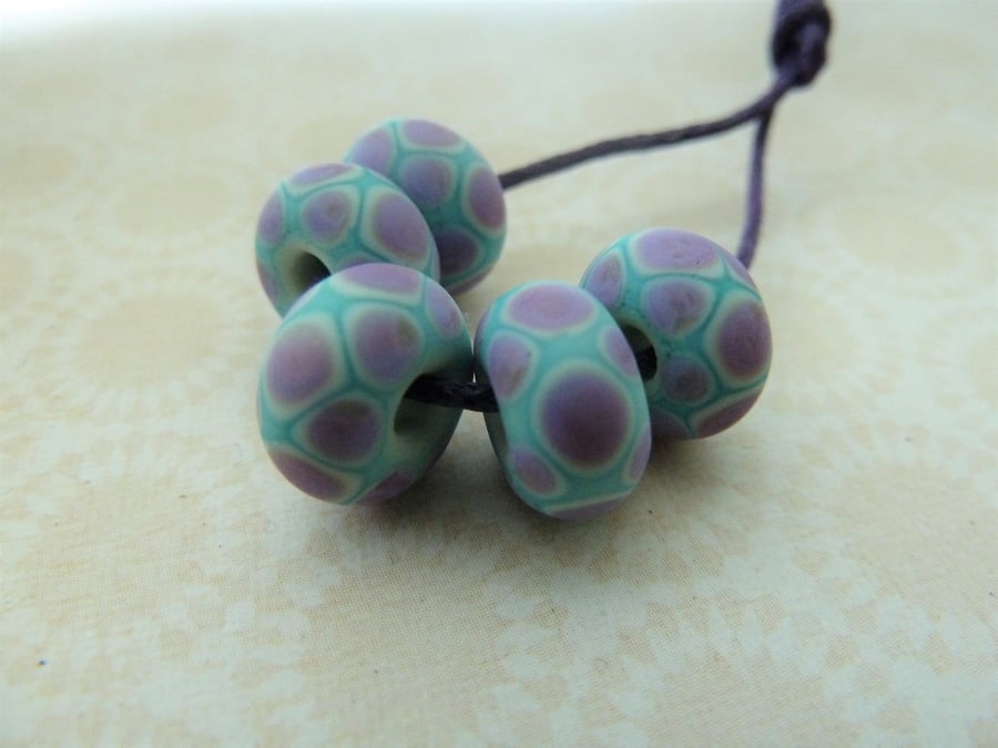 handmade lampwork glass beads purple and blue spots