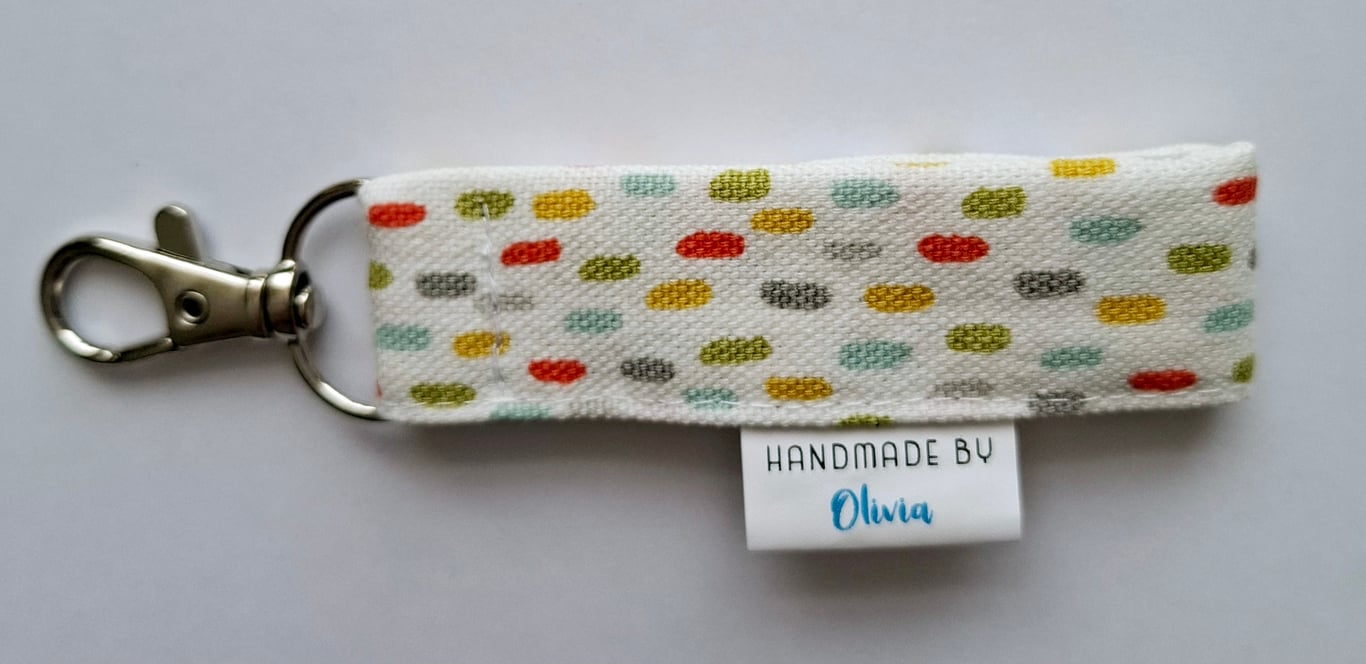 Micro keyring in multi-coloured fabric 