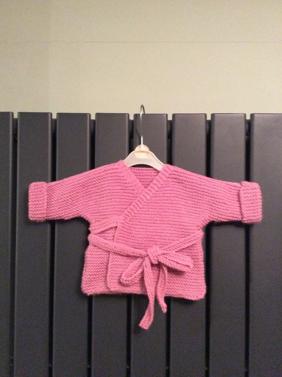 Hand knitted baby wrap cardigan - pink