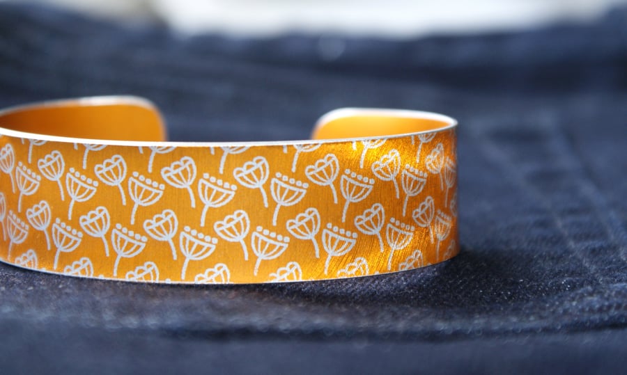 Geometric seed head print cuff bracelet orange
